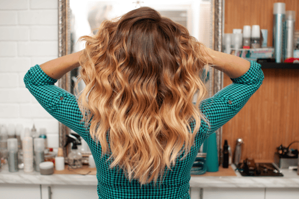 Top 6 Natural Shampoos for Colored Hair (Actually Non-Toxic!) 9 woman with colored hair