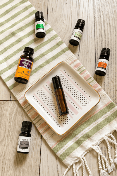 Easy Homemade Massage Oil for Joint Pain Relief 2 glass essential oil bottles