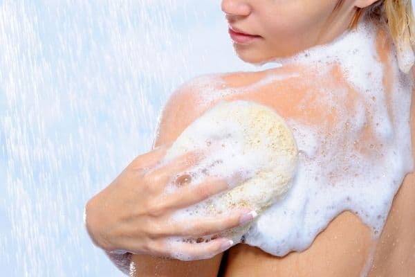 woman using body wash