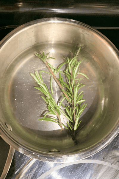 Easy Rosemary Water for Hair Growth Recipe | Does It Work? 5 rosemary water in saucepan